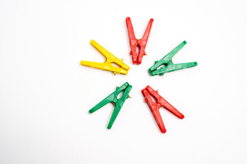 Colorful Clothespins Arranged in Circle on White Background