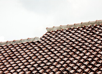 Roof tiles pattern and clear sky for background 