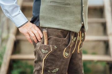 Knife and lederhosen worn by man at a cultural fest in Bavaria Germany