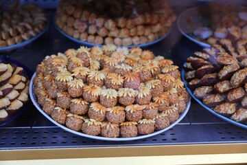 Moroccan majoun pastry ball with sesame seeds