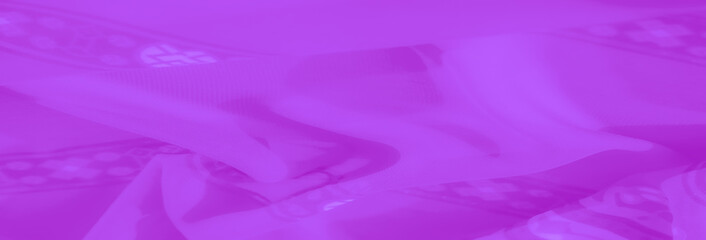 Blur. A richly textured purple fabric with repeating floral and geometric motifs, showcasing intricate design and subtle shimmering details, perfect for decorative purposes