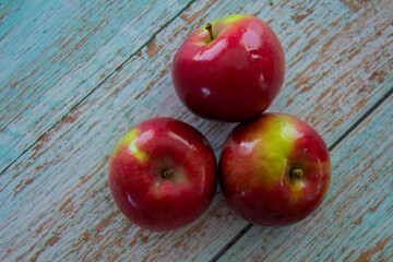Close-up of juicy apples isolated on a light background – healthy eating and autumn fruits