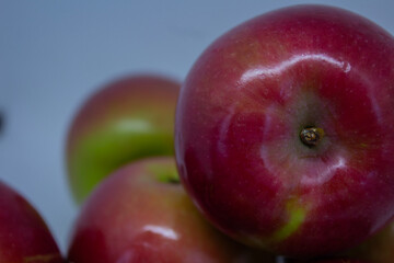 Close-up of juicy apples isolated on a light background – healthy eating and autumn fruits