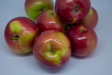 Close-up of juicy apples isolated on a light background – healthy eating and autumn fruits