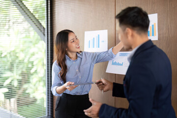 Presenting Data Insights. Professional explaining project results to colleague.