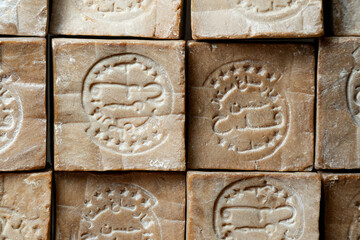 Close up of aged and dry traditional aleppo organic laurel soap bars  as a  background.