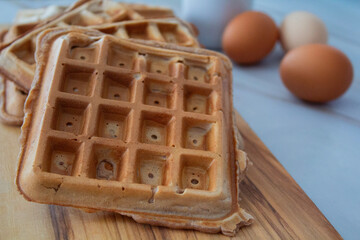 Freshly made waffles served with seasonal fruits and syrup – delicious homemade breakfast