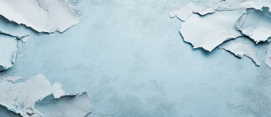 Obraz premium Cracked wall surface with a light blue background creating a textured and artistic feel