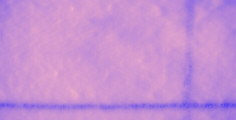 Blur of a soft, swirling fabric with gentle folds and a unique gradient of blue and pink tones, showcasing a smooth and luxurious texture perfect for backgrounds.