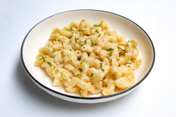 a plate of macaroni and cheese pasta isolated on white background