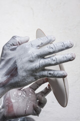 strong active hands working with pottery during the glazing process textured 