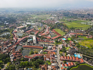 Obraz premium Aerial view of famous tourist area, Cipanas, in Garut Regency, West Java, Indonesia. Cipanas is famous as a hot spring bathing place that is naturally sourced from the mountains.