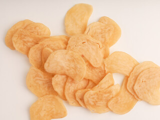 Heap of raw crackers on white background