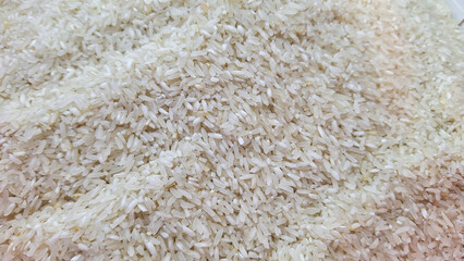 Dry Uncooked White Rice and Women Hand Background. Asian Cuisine and Culture. Healthy Eating Ingredients. Diet Food.