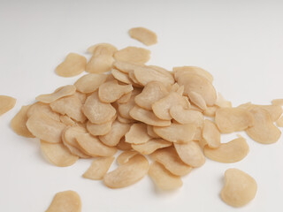 Heap of raw crackers on white background