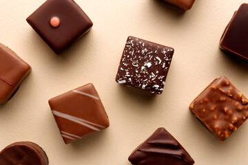 Minimal chocolate squares flatlay on beige background, elegant candy dessert concept