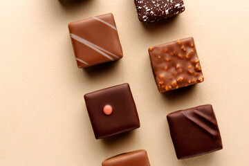 Minimal chocolate squares flatlay on beige background, elegant candy dessert concept