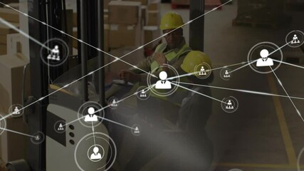 Warehouse supervisor tapping tablet at forklift sparking network overlay forming around boxes - Powered by Adobe