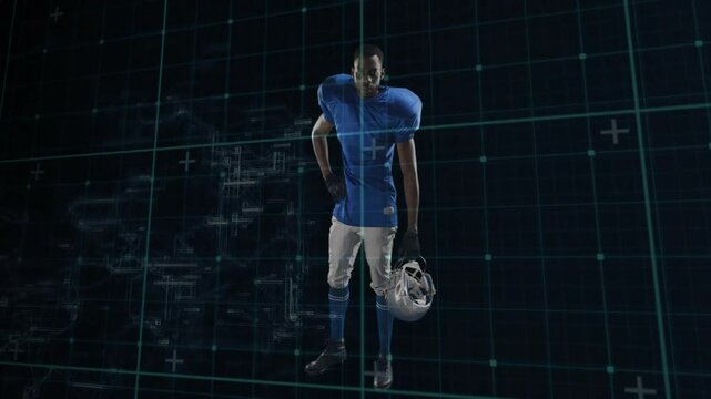 Football player holding helmet and shifting stance, saluting over teal grid for kickoff
