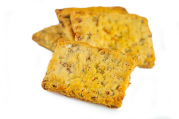 These seed-studded crackers display a rich golden surface with a slightly rustic finish, highlighting their delightfully crunchy edges and speckled interior for a satisfying bite.