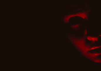 Creepy female portrait in red tones