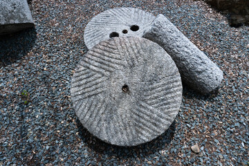 close-up ancient millstone down side	