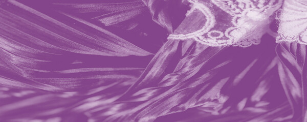 Ribbons of lace-like embroidery trace along lustrous ripples, uniting intricate motifs and airy pleats in a tranquil purple hue that imbues the scene with soft-spoken grandeur.