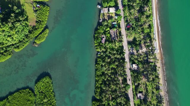 Bird's Eye View Over Batalay Coastal Barangay Of Bato, Catanduanes, Philippines - Drone Shot