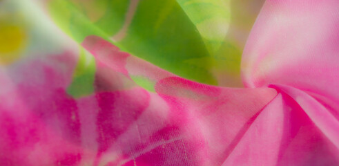 A delicate interplay of pink and white fabric softly billows, illuminated by a splash of sunny...