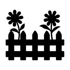 Black silhouette of a picket fence with flowers growing behind it