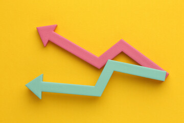 Multicoloured arrows pointing up and down. Symbolise growth progress, success in business finance. Rising bars of graphs represent market trends, return on investment, business development,