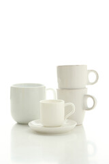 Beautiful White bright ceramic bowl and tarenes on the table. Clean crockery concept