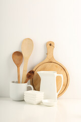 Beautiful White bright ceramic bowl and tarenes on the table. Clean crockery concept