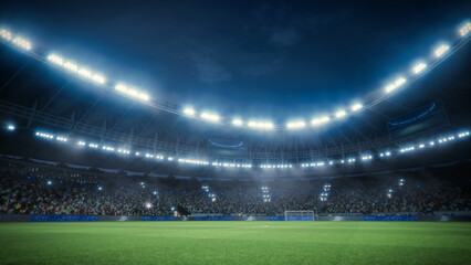 Aerial View of a Soccer Stadium at Night. Field, Goalposts, and a Large Crowd of Fans Are Cheering....
