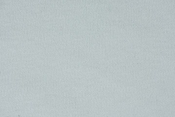 Macro texture of a fabric consisting of one hundred percent cotton.