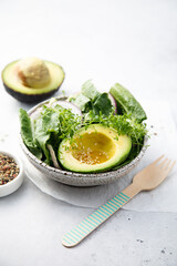 Avocado salad with microgreens and red onion