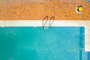 getting ready for summer cleaning the backyard pool top view, aerial directly above drone view