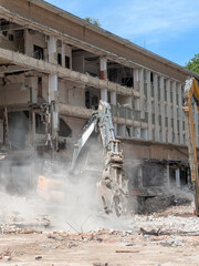 Demolition of Shopping centre Offices by an Industrial Grab Crusher Hydraulic Excavator
