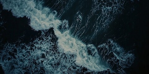 Dramatic aerial view showcases the turbulent energy of ocean waves crashing
