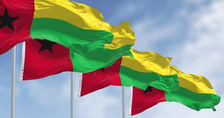 National flags of Guinea-Bissau waving in the wind on a clear day