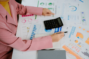 Finance bank tax expense accounting budget money businessman hand use calculator Financial...
