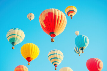 Fototapeta premium Colorful hot air balloons on blue background