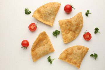 Traditional food of Ukrina Fried pastries, Pastel Frito Brasileiro, on a white table.