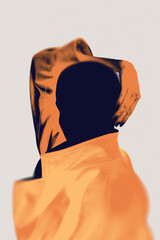 Abstract orange-toned figure on orange clothes isolated on neutral background. Concept of...