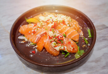 Spicy salmon salad on dish