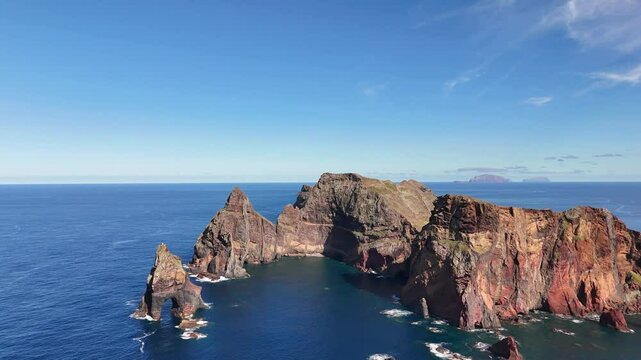 Slow drone orbit around sea cliff tunnel in Ponta de Sao Lourenco, Madeira Island, Portugal