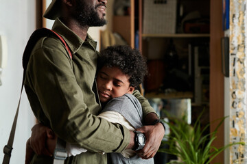 Heartwarming moment of parent and child embracing in indoor environment Human figures in warm and affectionate gesture conveying deep bond