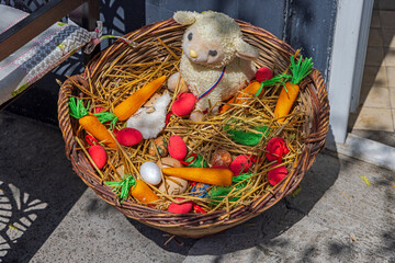 Little Lamb With Easter Eggs and Carrots in Straw Basket Spring Decoration
