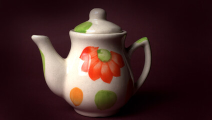 Indian masala chai or tea in cup, with kettle, spices and tea leaves on dark, wooden background. cafe, retro, restaurant, vintage, ethnic, healthy, hotel concepts.