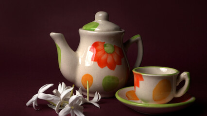 Indian masala chai or tea in cup, with kettle, spices and tea leaves on dark, wooden background. cafe, retro, restaurant, vintage, ethnic, healthy, hotel concepts.